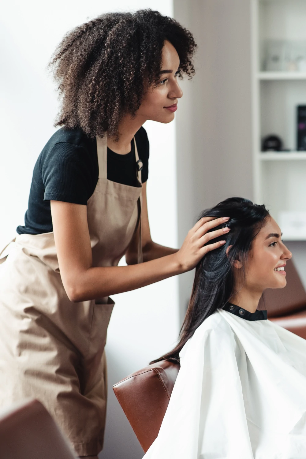 Hair salon owner reviewing scheduling software
